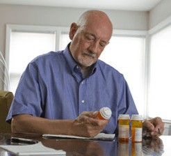 Man reviewing medications