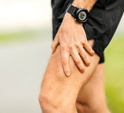 Runner with leg muscle spasm