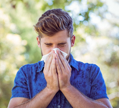 Man suffering from summer allergies